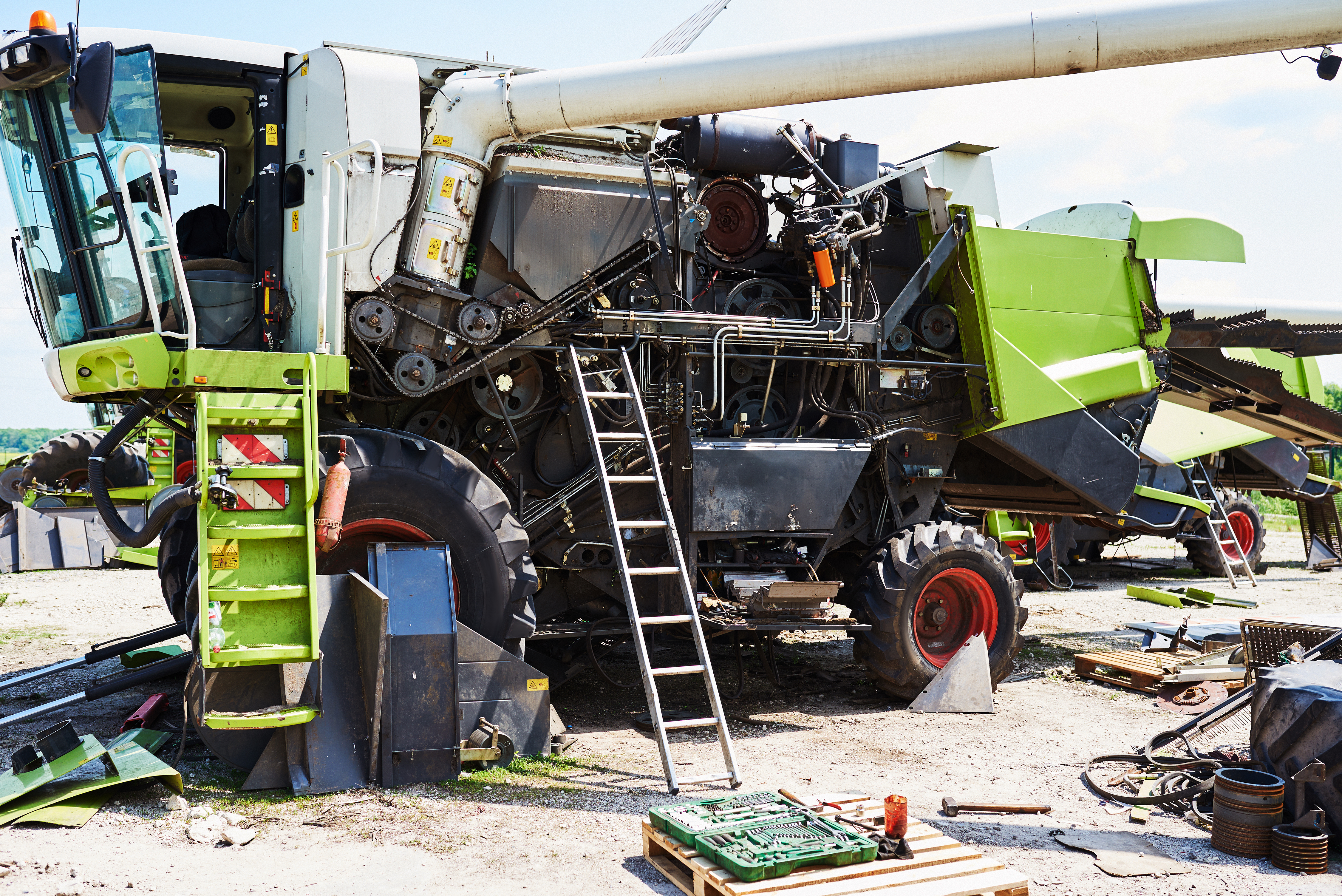 Mechanics working in a farm equipment workshop