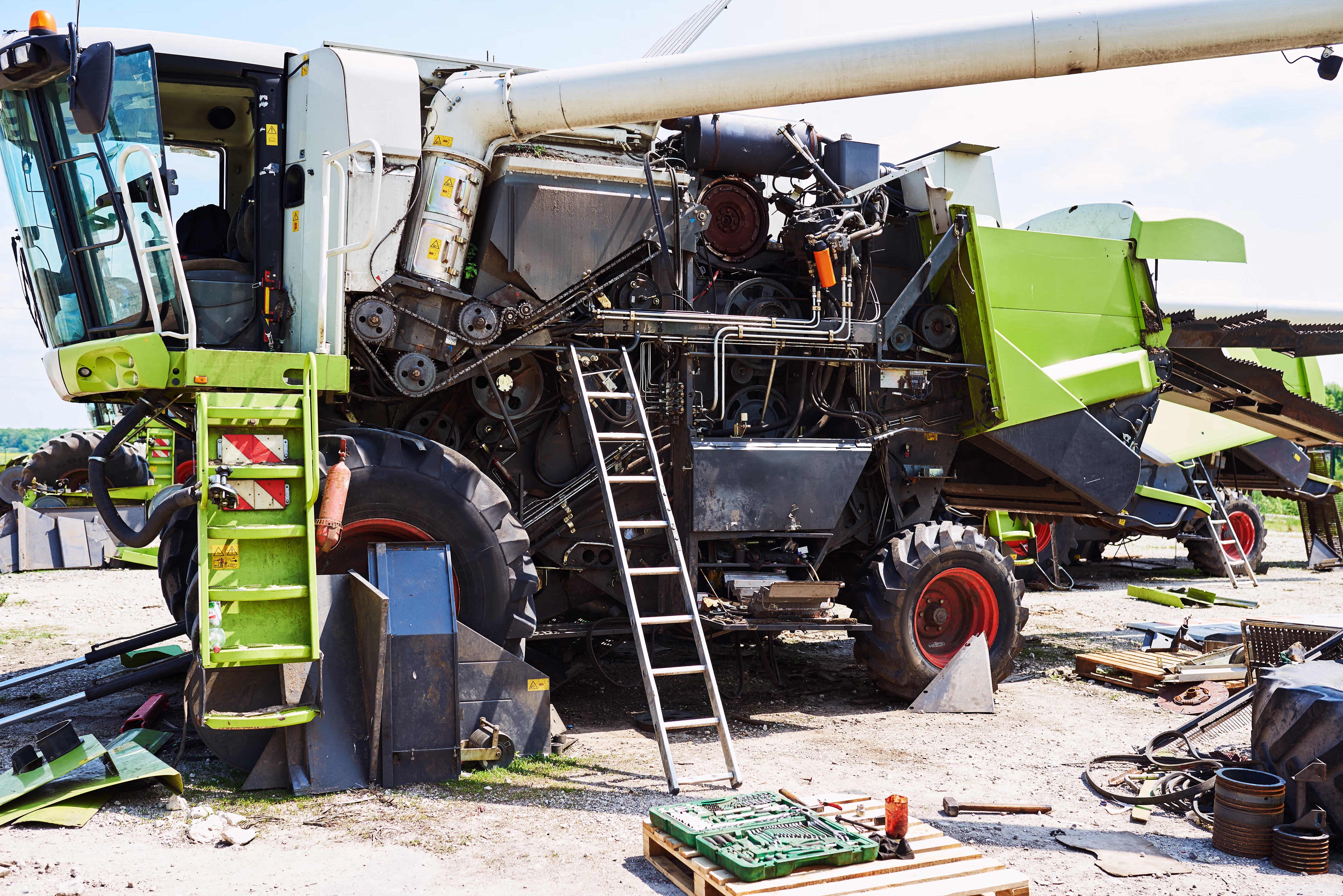 Mechanics working in a farm equipment workshop